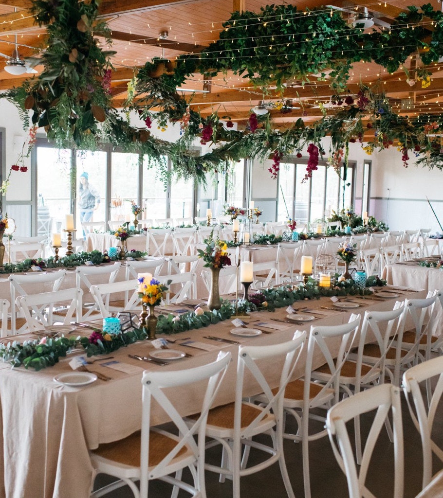 Wedding tables with decorated place settings.